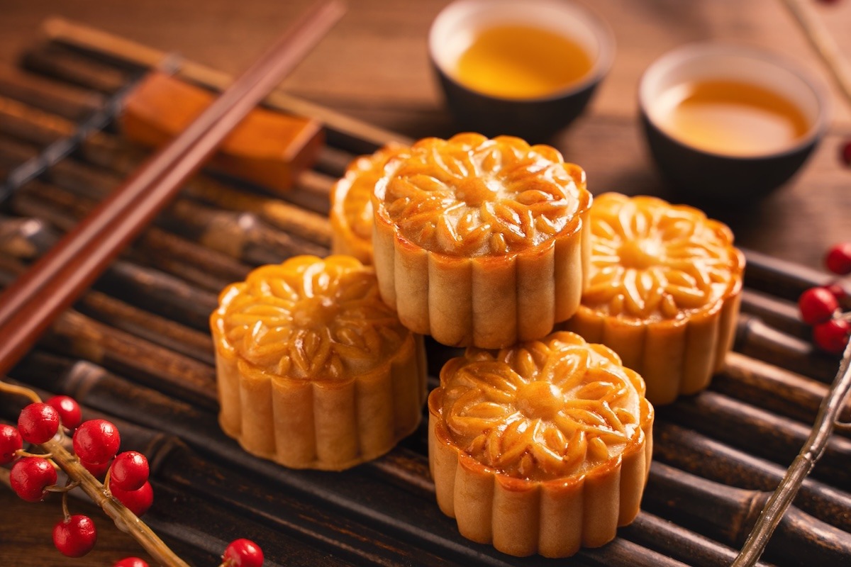 Moonlight and floating lotus lanterns on the water